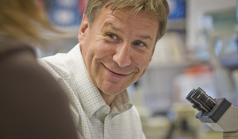 Dr. Stan Riddell works in his lab at the Fred Hutch office